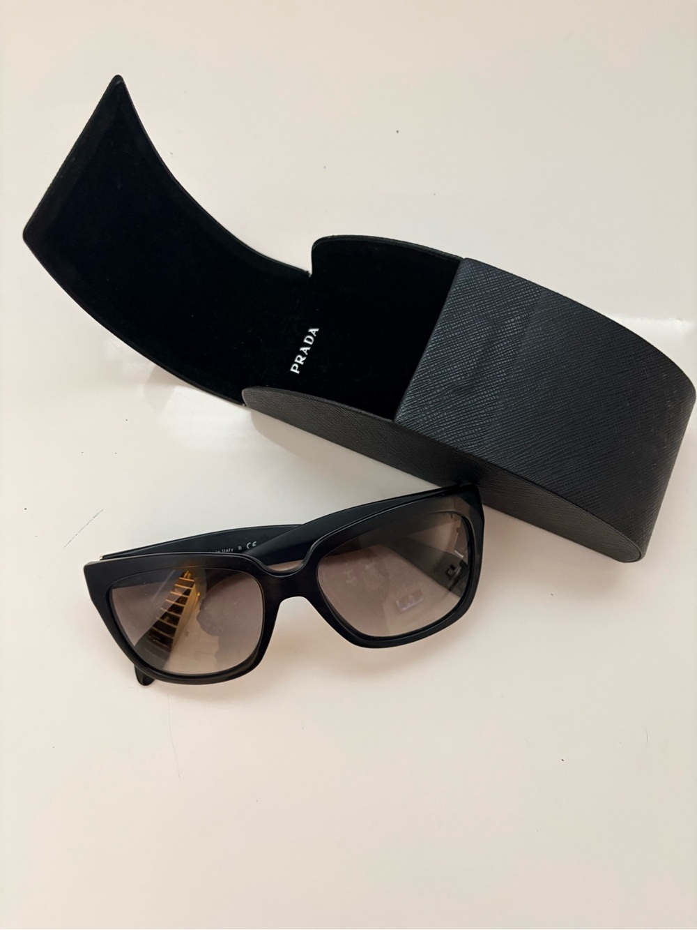 Prada Matte Black Rectangular Sunglasses with Gold Hinges